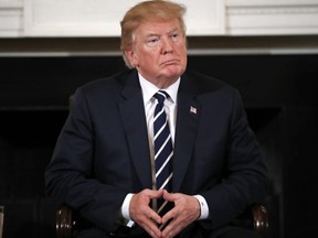 U.S. President Donald Trump hosts a listening session with high school students, teachers and parents in the State Dining Room of the White House in Washington, Wednesday, Feb. 21, 2018.