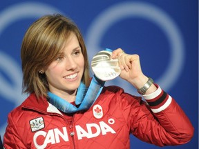 Canada's silver medalist Jennifer Heil celebrates during the medals ceremony on the podium of the Women's Moguls Freestyle Skiing event in Vancouver on February 14, 2010 during the Winter Olympics.