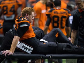 A pensive Travis Lulay sits on the sideline after leaving the Sept. 8, 2017 game against Montreal. Lulay suffered a torn ACL in his right knee, an injury he's trying to rehab at the age of 34.