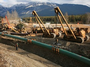 Finance Minister Joe Ceci says Alberta will rely on anticipated revenue from an expansion of the Trans Mountain pipeline to balance the budget within five years.
