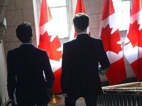 Finance Minister Bill Morneau, right, and Prime Minister Justin Trudeau leave the prime minister's office to table the federal budget in the House of Commons in Ottawa on Tuesday, Feb.27, 2018.