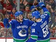 Brendan Gaunce is congratulated by Bo Horvat after scoring one of his two goals against the Blackhawks.