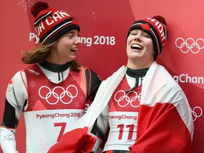 Alex Gough, right, celebrates her bronze medal with fifth place finisher Kimberley McRae in the women's luge event at the Pyeongchang Olympics on Feb. 13, 2018