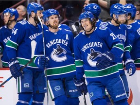 Vancouver Canucks' Loui Eriksson, front right, of Sweden, celebrates his goal against the Boston Bruins during the first period of an NHL hockey game in Vancouver, B.C., on Saturday February 17, 2018.