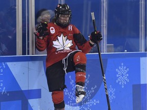 Canada forward Meghan Agosta, an officer with the Vancouver Police Department, celebrates her goal against the United States during preliminary round women's hockey action at the 2018 Olympic Winter Games in Pyeongchang, South Korea, on Thursday, Feb. 15.