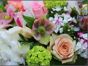 Viburnum, helleborus, roses, hydrangeas and dianthus intermingle beautifully in this contemporary bouquet.