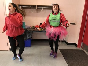 Sandra Jongs Sayer, the coordinator of the Vancouver Sun Run InTraining clinic in Langley, does a warmup "dance" at McLeod Athletic Centre before her group's Valentine's workout on Saturday, Feb. 10.