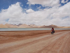 Kate Harris, author of Lands of Lost Borders: Out of Bounds on the Silk Road, is seen here cycling on the famous ancient trading route, the Silk Road.