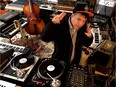 Kid Koala (a.k.a. Eric San) in his Montreal studio surrounded by beat making machinery.