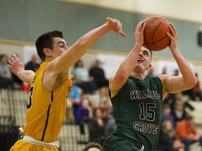 Ty Rowell of the Langley-based Walnut Grove Gators prepares to score against the Kelowna Owls and defender Owen Keyes in the championship final of the Terry Fox 28th annual Legal Beagle Invitational boys basketball tournament in Port Coquitlam on Jan. 7, 2017.