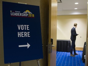 BC Liberal party staffers man a polling station at the Wall centre for the BC Liberal leadership convention, Vancouver, February 03 2018.