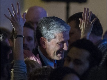 A women raises her hands as Andrew Wilkinson moves through the crowd after being elected leader at the BC Liberal party leadership convention at the vote at the BC Liberal party leadership convention, Vancouver, February 03 2018.
