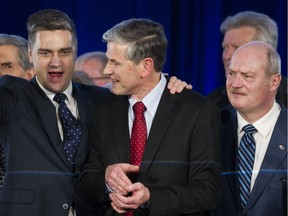 Andrew Wilkinson ( C ) is flanked by Todd Stone ( L ) and Mike de Jong ( R ) after Wilkinson was was elected leader at the BC Liberal party leadership convention at the vote at the BC Liberal party leadership convention.