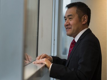 B.C. Liberal leadership candidate Michael Lee looks out the window at the Wall centre prior to the doors opening for the event, Vancouver, February 03 2018.