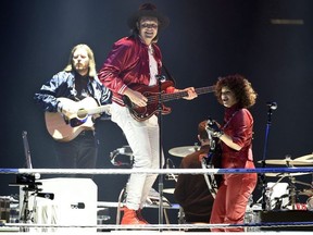 Tim Kingsbury, Win Butler and Regine Chassagne (left to right) of Arcade Fire perform during the band's concert at The Forum on Friday, Oct. 20, 2017, in Inglewood, Calif. Arcade Fire have been added as performers to next month's Juno Awards broadcast.THE CANADIAN PRESS/AP-Photo by Chris Pizzello/Invision/AP ORG XMIT: CPT108