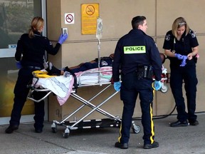 A shooting in a South Burnaby housing complex sent one man to hospital on Nov. 19, 2016. Officers can be seen escorting a victim into Royal Columbian Hospital.