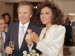Vic Damone (left) and Diahann Carroll show off their rings after their Jan. 3, 1987 wedding in Atlantic City, N.J. Damone died Sunday, Feb. 11, 2018, at a Miami Beach hospital from complications of a respiratory illness. He was 89.