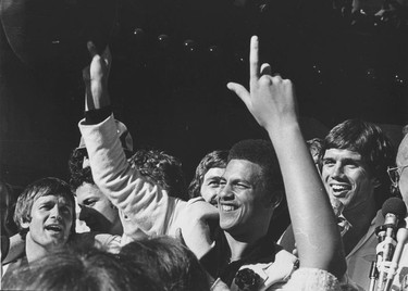 Whitecaps players Carl Valentine (left - hand up) and Bob Lenarduzzi (right - hand up)  in parade in Vancouver after winning the 1979 Soccer Bowl. Ralph Bower/Vancouver Sun