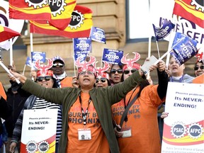 Public servants protest the pay problems caused by the Phoenix system during a demonstration outside the Office of the Prime Minister and Privy Council in October 2017.