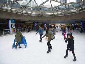 Skaters at the Robson Square Ice Rink in downtown Vancouver.