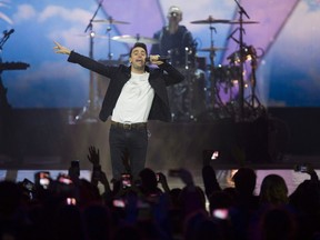 B.C. pop-rock group Hedley has responded to social media allegations of sexual misconduct levelled against the band. Frontman Jacob Hoggard of Hedley is pictured performing in October 2017 at Vancouver's Rogers Arena for WE Day.