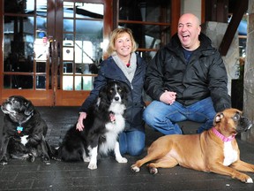 Annette Poitras and her husband, Marcel, with, from left, Bubba, Chloe and Roxy, celebrating their role in her successful rescue, in Coquitlam on Feb. 4.