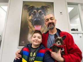 Zoran Radnic and his son Nikola brought their dog Lily to have a look at the new RAPS Animal Hospital in Richmond during Monday's grand opening.
