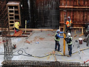 Workers toil at a construction site in downtown Vancouver Wednesday. Employers say B.C. faces a critical labour shortage.