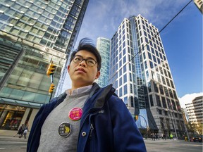 Nat Lowe of Chinatown Action Group stands outside the Beedie Group's office at 1111 West Georgia in Vancouver on Sunday. Lowe and other opponents of Beedie's 105 Keefer St. condo project plan to rally there Monday to push for social housing on the Chinatown site.