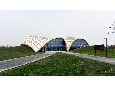 2018 International Wood Design winner is Jinjiang Zhou of Suzhou Crownhomes Co., Ltd., from Suzhou, China with the Timber Structure Enterprise Pavilion in Jiangsu Horticultural Expo, Suzhou City.  

For the ninth Jiangsu Horticultural Expo, the main hall of the timber structure enterprise pavilion was built under three concepts: pastoral landscape, ecological science and cultural life. This was achieved by assimilating the elements that are full of Jiangnan style – like the  fishing net, boat with a canopy and villages – and forming a totally coordinated architectural complex without losing rich changes. [PNG Merlin Archive]