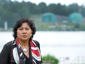 Charlene Aleck of the Tsleil-Waututh Nation stands at Cates Park in North Vancouver, across Burrard Inlet from Kinder Morgan's Westridge Terminal in Burnaby.