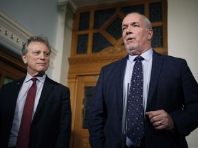 Premier John Horgan and Minister of Environment and Climate Change Strategy George Heyman answer questions about the Alberta dispute during a press conference at the Legislature in Victoria, B.C., on Wednesday February 7, 2018.