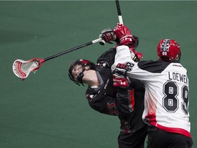 Thomas Hoggarth of the Vancouver Stealth, on the receiving end of a hard check from Calgary Roughnecks' Riley Loewen, was sent to Buffalo in a Monday trade with the Bandits. The Stealth acquired left-handed forward Pat Saunders.