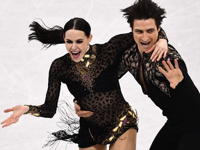 Virtue and Moir lead after the Olympic short program on Monday, after scoring a world record 83.67 points, but Papadakis and Cizeron are right on their heels.