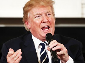 President Donald Trump speaks as he hosts a listening session with high school students, teachers and parents in the State Dining Room of the White House in Washington, Wednesday, Feb. 21, 2018. (AP Photo/Carolyn Kaster)