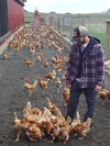 Egg farmer Scott Janzen with his hens. Janzen runs his Abbotsford farm, Janzen Poultry, with his wife and their two children.