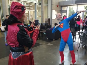 West Van Run Crew's Bradley Cuzen fashioned his Superman outfit for clubmate Debra 'Deadpool' Kato before last year's West Van Run 5K. The event used a super heroes theme last year to attract a super large crowd for its two-day running weekend.