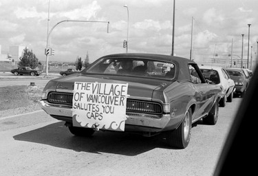 September 9, 1979 photo of fans welcoming the Vancouver Whitecaps home after winning the 1979 Soccer Bowl in New York against the Tampa Bay Rowdies  - car with sign "the village of Vancouver salutes you" in reference to comment made by New York commentator.