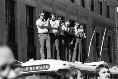 September 9, 1979 photo of fans welcoming the Vancouver Whitecaps home after winning the 1979 Soccer Bowl in New York against the Tampa Bay Rowdies - bus drivers standing on Robson bus.