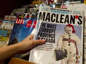In this file photo, a woman takes a copy of Maclean's magazine from a magazine rack from a store in Vancouver, BC, Friday, September 24, 2010.
