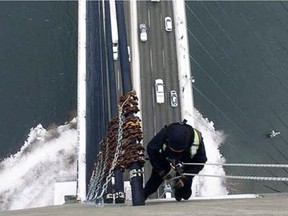 Chain collars have been installed to safely clear ice and snow buildup on the support cables of the Alex Fraser Bridge.