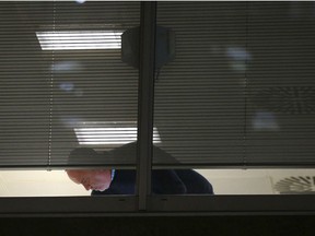 Information Commissioner's Office enforcement officers work inside the offices of Cambridge Analytica in central London after a High Court judge granted a search warrant, Friday March 23, 2018. The investigation into alleged misuse of personal information continues Friday to determine whether Cambridge Analytica improperly used data from some 50 million Facebook users to target voters with ads and political messages