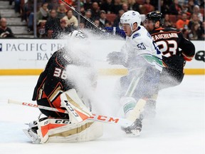 Bo Horvat gives goalie John Gibson a snow shower on Wednesday