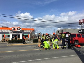 A hazardous materials team at an A&W restaurant on Esquimalt Road after chemicals were improperly mixed inside. The resulting chlorine gas led to the evacuation of the restaurant.