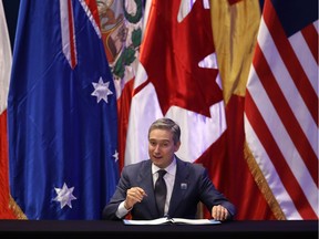 Canada's trade minister, Francois-Philippe Champagne, signs the rebranded 11-nation Comprehensive and Progressive Agreement for Trans-Pacific Partnership (CPTPP) in Santiago, Chile, on March 8.