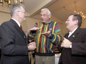 On municipal election night in Kelowna in 2002, then-mayor Walter Gray, left, talks with councillors Barrie Clark (centre) and Al Horning.