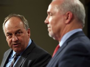 Green Party Leader Andrew Weaver, left, and B.C. Premier John Horgan don't appear to be on the same page with LNG Canada, but will that bring the government down eventually?
