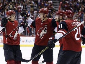 Oliver Ekman-Larsson celebrates his power-play goal Sunday.