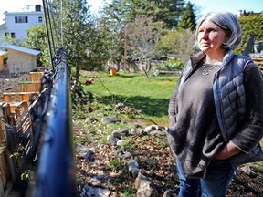 VICTORIA, B.C.: March, 15, 2018 -   Portrait of Chantal Meagher in her backyard at 1347 Craigdarroch Rd,  She is very concerned about the 100 chickens and chicken coops being built on the neighbouring property.  VICTORIA, B.C. March  15, 2018. (ADRIAN LAM, TIMES COLONIST). For City story by Katie DeRosa. [PNG Merlin Archive]