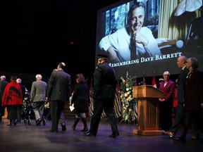 Premier John Horgan arrives with Lt.-Gov. Judith Guichon, right, to remember and celebrate former NDP Premier Dave Barrett during a state memorial service in the Farquhar Auditorium at the University of Victoria in Victoria on Saturday, March 3.